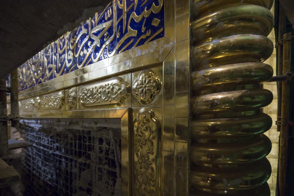 The installation of the gilded Quranic bands in the great gold Iwan of the shrine of Aba al-Fadl al-Abbas (peace be upon him).