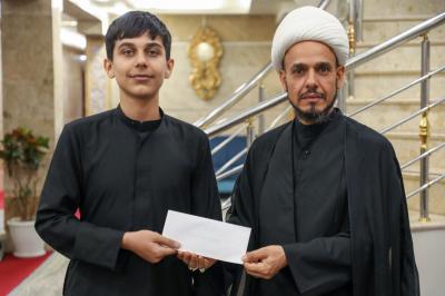المجمع العلمي يكافئ مجموعة من طلبته الحافظين لكتاب الله