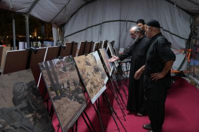 المركز العراقي لتوثيق جرائم التطرف يقيم معرضًا صوريًّا على طريق زائري الأربعين في النجف
