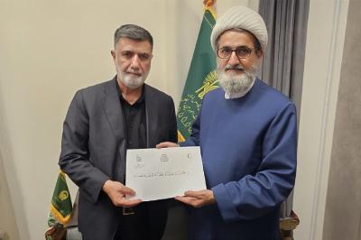 وفد العتبة العباسية المقدسة يسلّم راية الإمام الحسن (عليه السلام) إلى العتبة الرضوية المقدسة