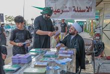 فرقة العباس (عليه السلام) تقدم خدمة الاستفتاءات الشرعية لزائري الأربعين