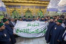 العتبة العباسية تستلم راية الإمام الحسن (عليه السلام) من العتبة الحسينية