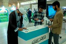 توافد غفير على جناح المجمع العلمي في معرض طهران للمشاركة بمسابقته القرآنية