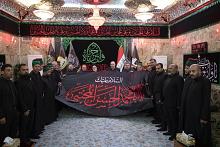 العتبة العباسية تسلم راية الإمام الحسن (عليه السلام) للعتبة الحسينية المقدسة