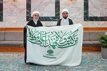 العتبة العباسية المقدسة تتسلم راية عيد الغدير من العتبة العلوية المقدسة