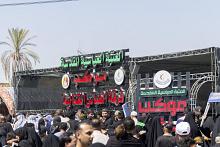 موكب فرقة العباس (عليه السلام) يقدم خدماته لزائري مدينة سامراء في ذكرى شهادة الإمام الحسن العسكري (عليه السلام)