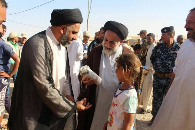بعد أن فارقت محيّاهم: لجنة إغاثة النازحين في مكتب المرجعيّة الدينيّة العُليا تُدخل الفرحة والسرور على الأطفال النازحين وأمّهاتهم في مخيّمات حمام العليل للنازحين..