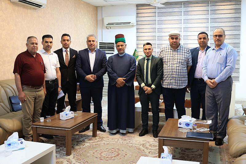 وفد العتبة العباسية ينهي توزيع دعوات الحضور لأسبوع الإمامة في جامعة الكوفة