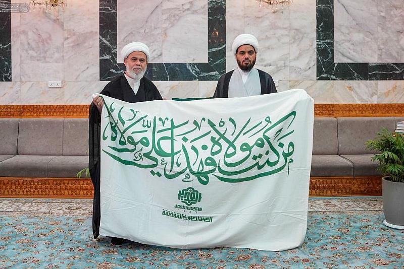 العتبة العباسية المقدسة تتسلم راية عيد الغدير من العتبة العلوية المقدسة